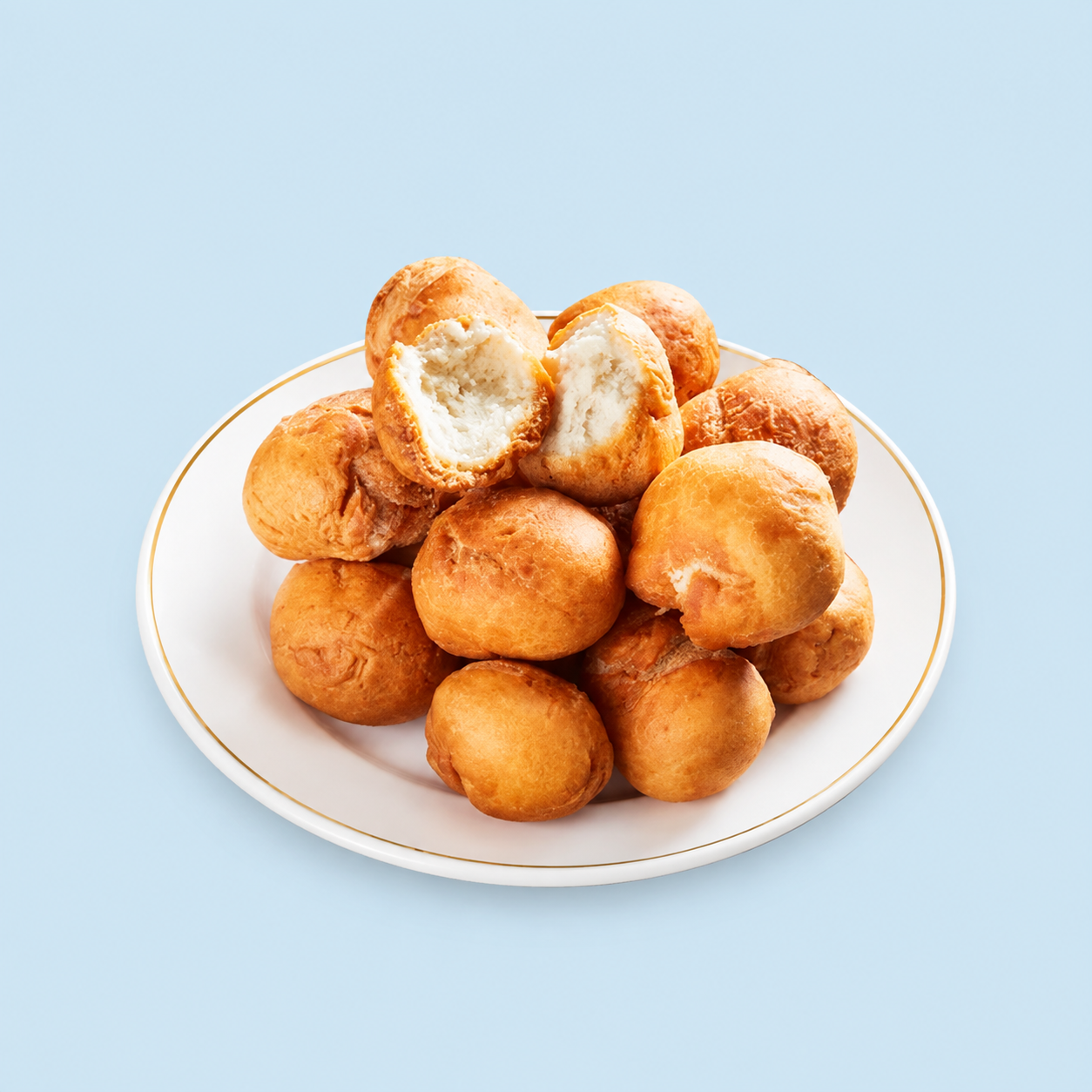 Traditional Bajan bakes with one bake opened to show the soft inside
